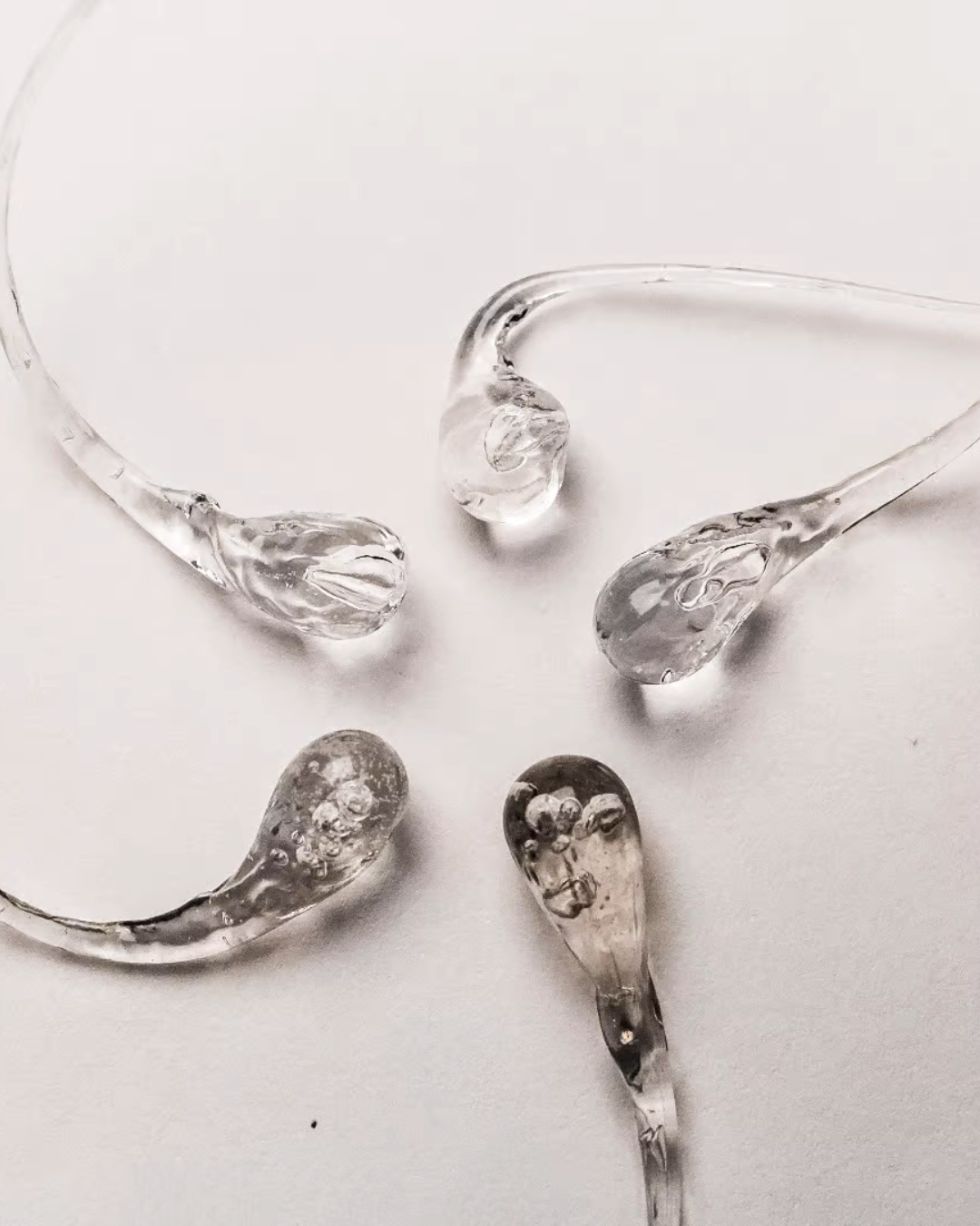 An exploded Prince Rupert’s Drop captured mid-shatter, demonstrating its remarkable fragility and scientific intrigue.